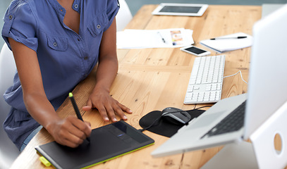 Image showing Business, woman and hands with tablet or writing in office for web design, technology and planning at desk. Digital, person and designer with laptop for photoshop, creative and editing at workplace