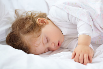 Image showing Face, baby and kid sleeping on bed for calm break, peace and dreaming to relax at home. Tired young child asleep with blanket for newborn development, healthy childhood growth or rest in nursery room