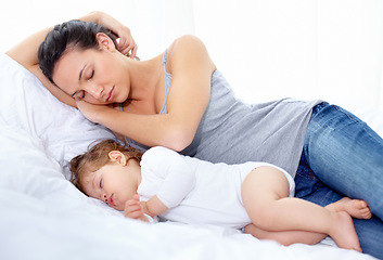 Image showing Mother, baby and sleeping on bed together for calm break, peace and dreaming to relax at home. Tired mom, young kid and asleep for newborn development, healthy childhood growth and cozy nap for rest