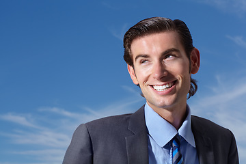 Image showing Face, smile and vision with a business man on a blue sky background, thinking about the future. Corporate, idea and a happy young professional employee outdoor in a suit for company planning