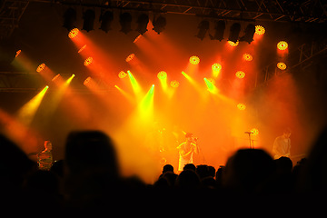 Image showing Crowd silhouette, music band and concert audience listen to club artist, stage performance or celebrity star. Night event lights, rave festival and dark shadow group, fans or people at musician show