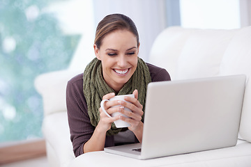 Image showing Laptop, relax and happy woman on a sofa with coffee while streaming movie, film or video at home. Pc, smile or female person in a living room with tea, break or social media, subscription or show