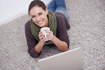 Image showing Woman, laptop and relax in portrait with coffee, happy with tech and streaming online for video or movie with internet at home. Connect, film or tv show, carpet or floor for entertainment and drink