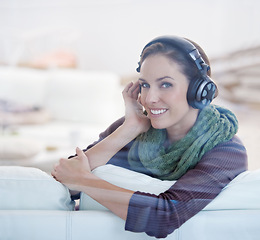 Image showing Portrait, smile and woman with music headphones on a sofa streaming, listening or chilling at home. Happy, face and female person in a living room with earphones for radio, audio or playlist track
