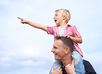 Image showing Father, outdoor and carrying child on shoulders for childhood playing, sunshine and wellness by blue sky. Parent, son and pointing in nature for bonding together, love and fun on outside on vacation