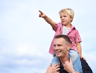 Image showing Love, hand pointing and piggyback by father and son outdoor for fun, bonding or travel adventure. Happy family, support or parent with boy kid outside for shoulder ride, games or care on explore trip