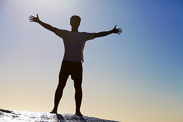 Image showing Man, horizon and freedom, blue sky and hiking in nature for adventure and fitness, mockup space and travel. View while trekking, journey and hiker with outdoor view, sun and exercise on mountain