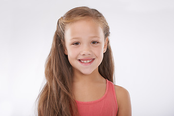 Image showing Portrait, girl and child on studio with smile, confidence and good mood isolated on a white background. Happy young kid with pride, positivity and cheerful expression from New Zealand at mockup space