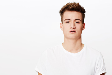 Image showing Portrait, fashion and man with casual outfit, confident guy and gen z isolated on a white studio background. Face, person and model with mockup space, stylish clothes and cool with attitude and edgy