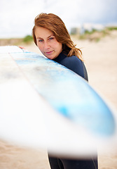 Image showing Beach, holding or woman with surfboard on vacation for fitness training, wellness or travel. Athlete, surfer cleaning or ready to start surfing at sea on holiday in Hawaii or ocean in extreme sports
