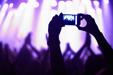Image showing Nightclub, concert and audience with phone or lights for music, party and rave festival with silhouette and dancing. Disco, psychedelic event or performance with entertainment, crowd and smartphone