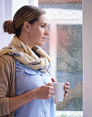 Image showing Woman at window, thinking with tea and reflection, life and future in morning routine, raindrop and wellness. Insight, memory and mindfulness with warm beverage, coffee break and relax at home