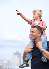 Image showing Hand pointing, piggyback or father and son outdoor for walking, adventure or bonding on sky background. Love, family and parent with boy kid outside with gesture for travel, direction or journey