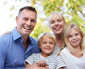 Image showing Happy, parents and children in garden for portrait outdoor in summer with love, freedom and together in nature. Family, care and support kids with smile in backyard at home with mother and father