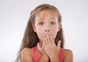 Image showing Child, portrait and hand or mouth for shock information or surprise news for announcement, omg or white background. Female person, face and gesture in studio for gossip emoji, wow or mockup space