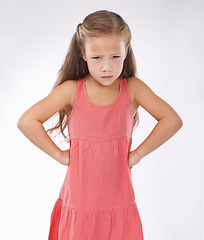 Image showing Portrait, unhappy or tantrum and girl child in studio on white background with anger and frustration. Cross, problem or moody and young kid with bad attitude looking upset at problem or mistake