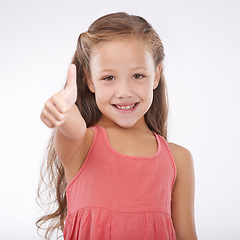 Image showing Thumbs up, kid and portrait of girl in studio for winner, achievement or celebrate success on white background. Happy child, emoji or like sign for yes, feedback or thank you for agreement of support