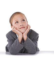 Image showing Child, thinking and business career in suit for future professional dreams, white background or studio. Kid, girl and desk for grownup goals as worker in corporate company, thoughts or mockup space