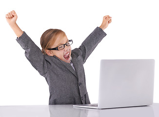 Image showing Business, child and celebrate win on laptop in studio, promotion and fist pump for achievement. Female person, bonus and pretend play on white background, prize and investment or sale in fantasy game