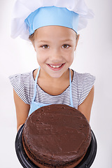 Image showing Kid, baker and portrait with cake, happy and confident with child development on white background. Culinary skills, satisfied and baking dessert and childhood with chocolate in hospitality industry