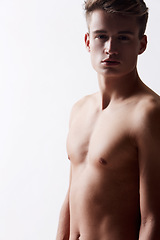Image showing Portrait, natural and masculine with shirtless man in studio on white background for health or wellness. Aesthetic, skin or stomach and body of fresh young model in for hygiene and satisfaction