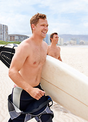 Image showing Fitness, surfing and friends running on beach together for travel, sports or exercise in summer. Training, smile and shirtless surfer men on sand for vacation or holiday on coast of Australia