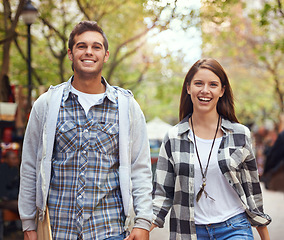 Image showing Portrait, walking and happy couple holding hands on city journey, morning trip and tour of urban Paris for outdoor adventure. Love, travel and bonding man, woman or people together on relax commute