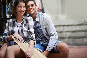 Image showing Couple, skateboarding and portrait in city, happy and excited to learn together and romantic relationship. Cape town, fun and hobby with boyfriend and girlfriend in street, relaxing and dating