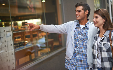 Image showing Bakery, pointing and couple with love, shopping and conversation with romance, customer and cheerful. Outdoor, happy man or woman with embrace, excited or sale with cakes, discount deal or discussion