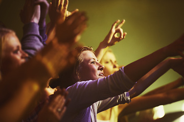 Image showing Concert, fans and dance to music at night,, performance and audience with energy at festival. Crowd, support and people stretching hands in celebration or praise of rock, culture or excited at event