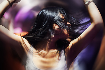 Image showing Club, dance floor and woman with energy, music and freedom, blur and celebration fun. Party, concert and female person in a crowd with movement, motion and good vibes at festival, event or nightclub