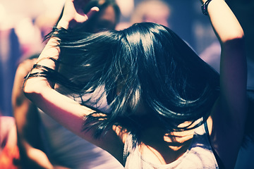 Image showing Dance floor, club and woman with energy, hair and freedom, music and fun celebration. Party, concert and female person in a crowd with movement, motion and good vibes at festival, event or nightclub