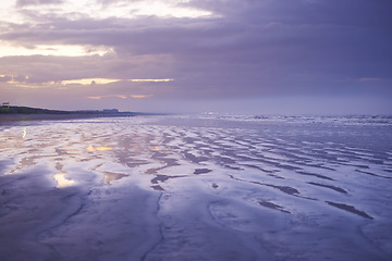 Image showing Ocean, sunset and waves at the beach with adventure, holiday or weekend trip paradise. Landscape, evening and horizon for outdoor travel and journey by seashore with water and tropical island