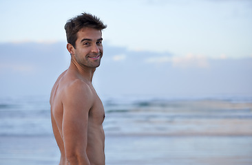 Image showing Portrait, muscular and beach with man, vacation and adventure with tropical island getaway and summer break. Face, seaside or person with smile or shirtless with journey, holiday or ocean with travel