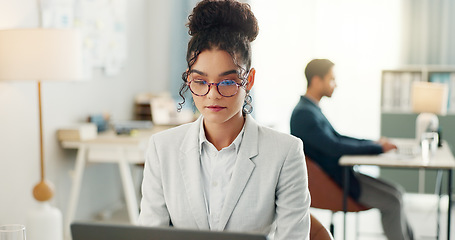 Image showing Woman with smile, laptop and typing in coworking space, research and online schedule at consulting agency. Office, networking business and girl at computer writing email review, feedback or report.