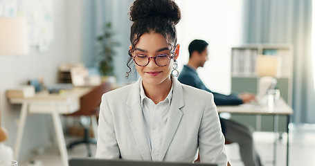 Image showing Woman with smile, laptop and typing in coworking space, research and online schedule at consulting agency. Office, networking business and girl at computer writing email review, feedback or report.