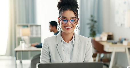 Image showing Happy woman with glasses, laptop and typing in coworking space, research and online schedule at consulting agency. Office, networking business and girl at computer writing email, review or report.