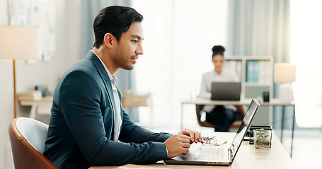 Image showing Man at desk, laptop and typing in coworking space, market research and online schedule at consulting agency. Office, admin and happy businessman at computer writing email review, feedback or report.