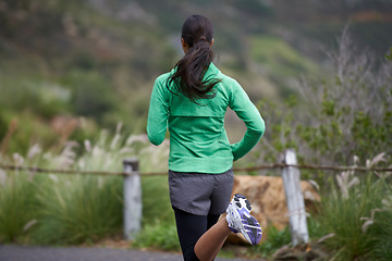 Image showing Back, road and running with woman, fitness and morning with fresh air and exercise for health, wellness and cardio. Person, runner or athlete with workout or training with nature, energy or challenge