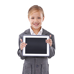 Image showing Child, girl and tablet screen in studio for education, online school and marketing space on a white background. Student or kid portrait on digital technology and mockup for e learning presentation