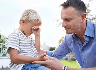 Image showing Crying, comfort and dad outside with child, pain and help with emotional boy in garden of home. Love, support and tears, sad kid and dad in backyard with empathy, injury and care for childhood stress