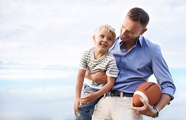 Image showing Blue sky, football and father with young son on outdoor adventure, playful or excited mockup space. Relax, bonding together and family, happy child and dad on summer holiday for fun, game and smile.