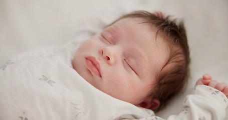 Image showing Baby, sleeping youth and nursery bed with morning, nap and dreaming of a young newborn at home. Cozy, sleepy kid and calm with health development from rest and peace in a house with closeup and care