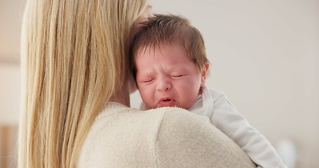 Image showing Comfort, mother and a crying newborn for love, care and sad in the morning. House, family and a young mom or woman with affection, support and holding a baby, child or kid for sleep, rest or tired