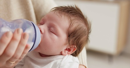 Image showing Baby, nursery and mother with bottle for feeding, drinking milk and formula for health, wellness and growth. Family, love and parent with newborn sleeping for child development, hunger and nursing