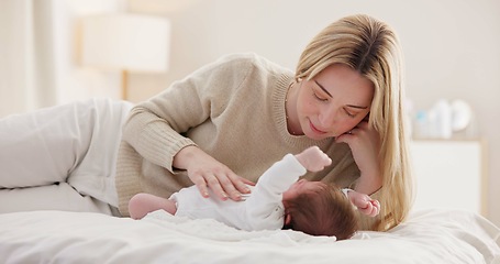 Image showing Children, love and a mother on the bed with her baby for sleep, rest or bonding together in a home. Family, bedroom and a woman in an apartment with her newborn infant to relax for care or growth