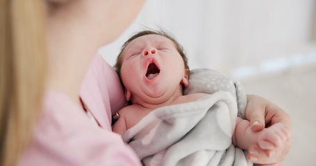 Image showing Baby, yawn and calm with tired newborn and mom in a bedroom at morning with care. Rest, relax and young kid with fatigue and mother support in a family home with motherhood in house with blanket