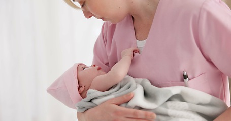 Image showing Nurse, woman and newborn in hospital for wellness, medical checkup or examination with support or care. Pediatrician, professional and holding baby in clinic with bond and relax for child development