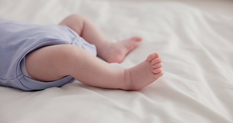 Image showing Adorable, family and feet of baby on bed for child care, relax and resting in nursery. Innocent, cute and closeup of toes of innocent newborn infant for health, wellness and development at home