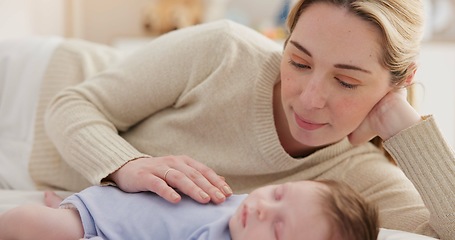 Image showing Family, love and a woman on the bed with her baby for sleep, rest or bonding together in a home. Children, bedroom and a mother in an apartment with her newborn infant to relax for care or growth